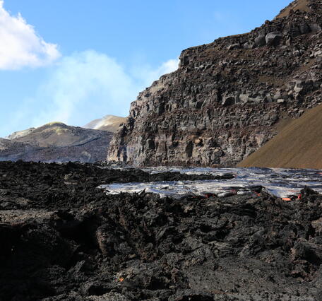 Color photograph of lava flow near crater wall