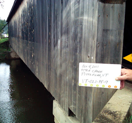 Covered bridge showing a high-water mark from tropical storm Irene
