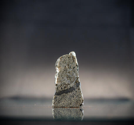 USGS mineral specimen showing chromite band in gabbro with platinum content.