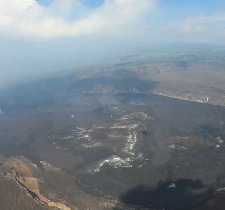 Color photograph of misty volcanic crater