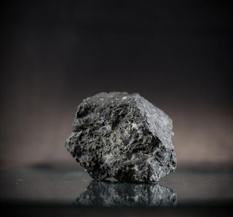 High-definition image showing coarse-grained texture and dark coloration.