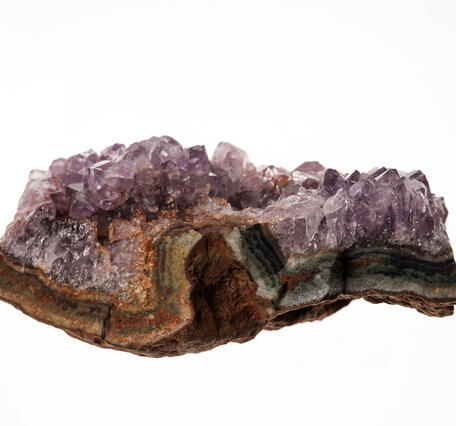 High-definition image of quartz specimen with visible inclusions and prismatic structure.