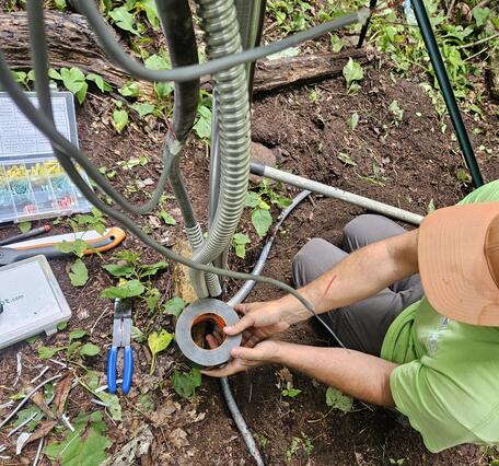 Hydrologic Technicians repair landslide monitoring site in Shumont Mountain, NC