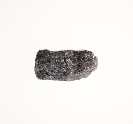  High-definition image of silicon metal specimen with fine-grained texture and silvery color.