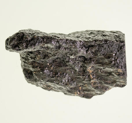 High-definition image of silver-bismuth ore specimen with dark matrix and metallic flecks.