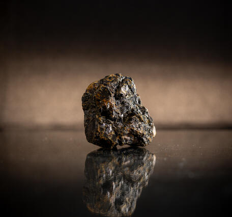 High-definition image of sphalerite specimen with dark coloration and crystal structure.