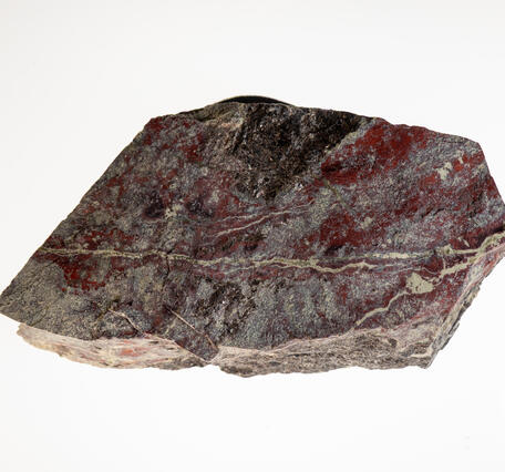 High-definition image of sphalerite and serpentine specimen with layered structure and greenish hue.