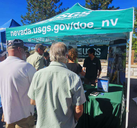Attendees gather at the USGS booth at the 2026 Tahoe Summit