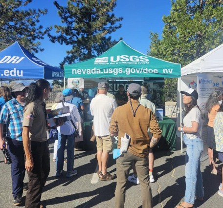 Attendees gather at the USGS booth at the 2026 Tahoe Summit