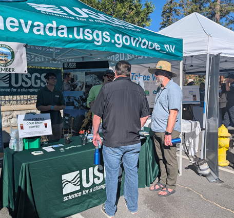 Even more attendees gather at the USGS booth at the 2026 Tahoe Summit