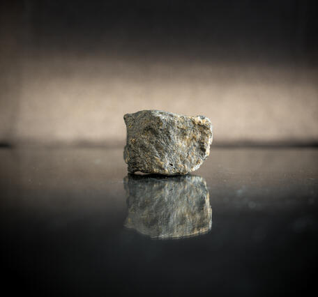 High-definition image of argentiferous tetrahedrite specimen with dark coloration and metallic inclusions.