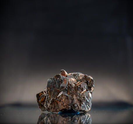 High-definition image of wolframite specimen with fine-grained texture and dark luster.