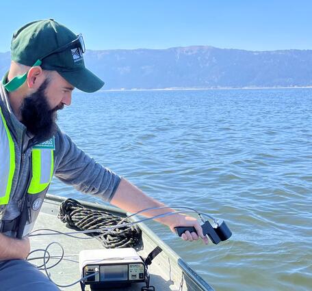 USGS using spectral radiometer from boat in Lake Cascade, Idaho 