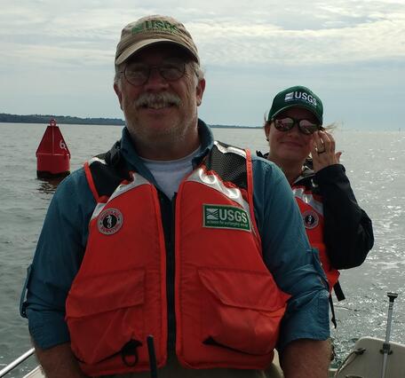 Photo of Hydrologist, Dave Armstrong, driving a boat
