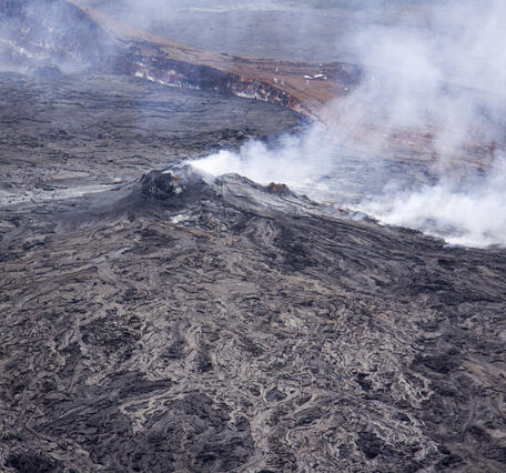 Incandescent skylights adorn the spatter cone and the lava tube in ...