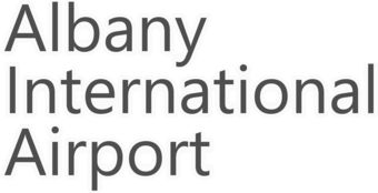Gray font with light gray halo displaying official airport name.