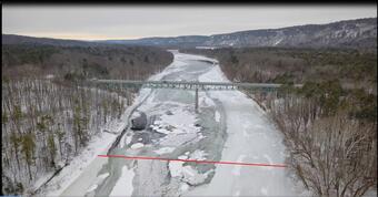 Aerial view of the Delaware River and the Bridge at Montague, New Jersey with a red line across the river
