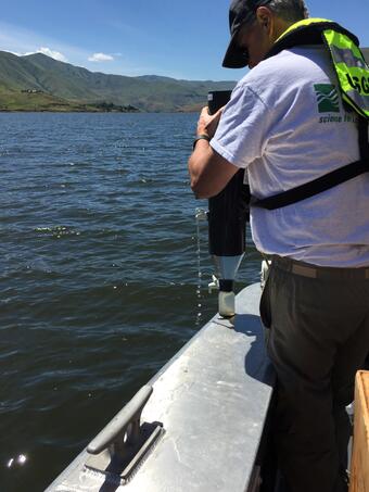USGS scientists deploys sediment in a canyon reservoir
