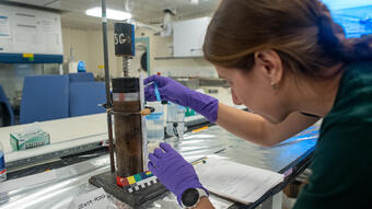Hope Ianiri processes a seafloor sediment core collected from a hydrothermal site