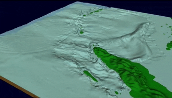 Moving illustration shows the origin and propagation of tsunami waves through the ocean and around islands.