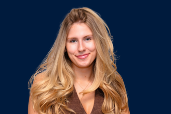 Headshot of a woman with long blond hair 
