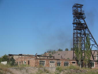 Brown brick building and mining structures