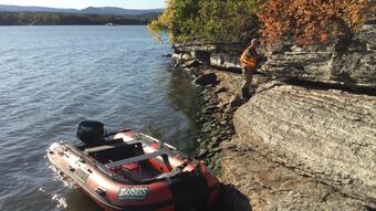 Randy Orndorff examines limestone on Lake Champlain, VT