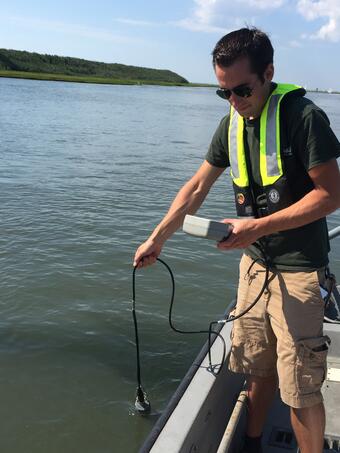 Taking water Quality samples off of a Boat