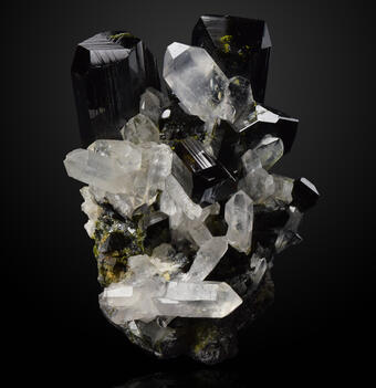 Image shows a sample of epidote and quartz against a black background