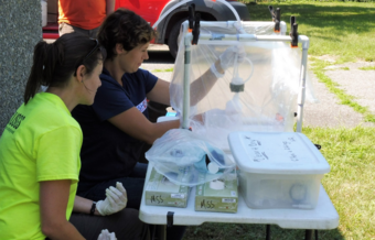 Two scientists collecting groundwater to use for analysis