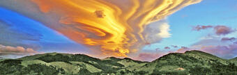 Lenticular clouds over hills in New Zealand.