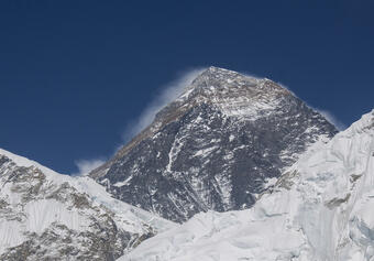 Mt. Everest, showing snow blowing off the peak.