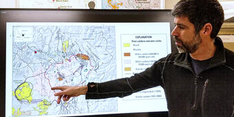 Man standing in front of TV