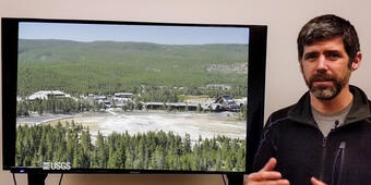Man standing in front of TV