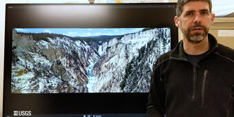 Man standing in front of TV