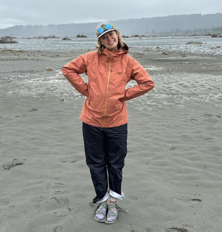 Photo of USGS employee, Augusta Gruhlke, standing on a sandy beach