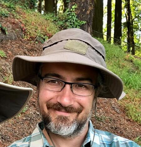 Headshot picture of Adam Mumford.