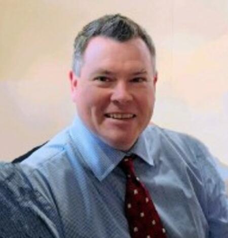 Headshot of Ethan Weikel.