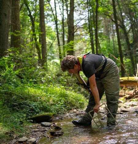 Image showing Zach Clifton conducting field measurements.
