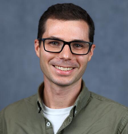 Photo of Phillip Goodling in glasses with a green shirt