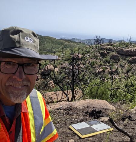 USGS scientist in front of a UAS ground control target at a burned site at the Lake–Napa Unit Lightning Complex fire area