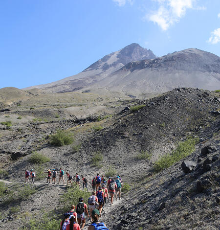 Girls hike along a trail at Mount St. Helens