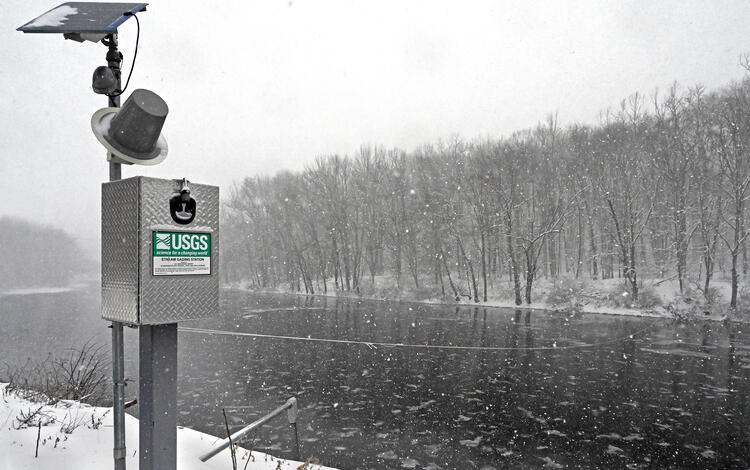 Streamgage during a grey, snowy day
