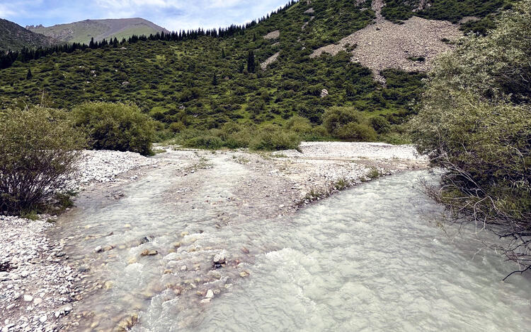 A glacier-fed river flows though Ala-Archa National Park in the Chuy Region of the Kyrgyz Republic
