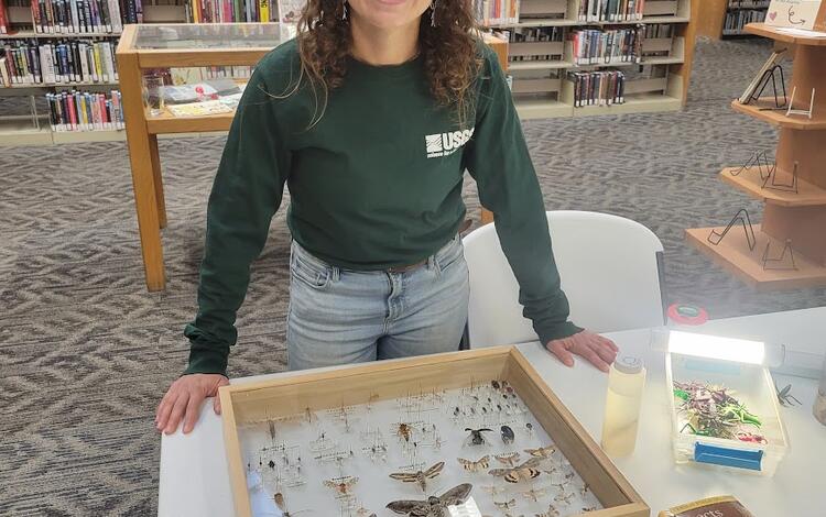 Anya Metcalfe displays aquatic insect samples during an outreach event at the Flagstaff Library about the Colorado River