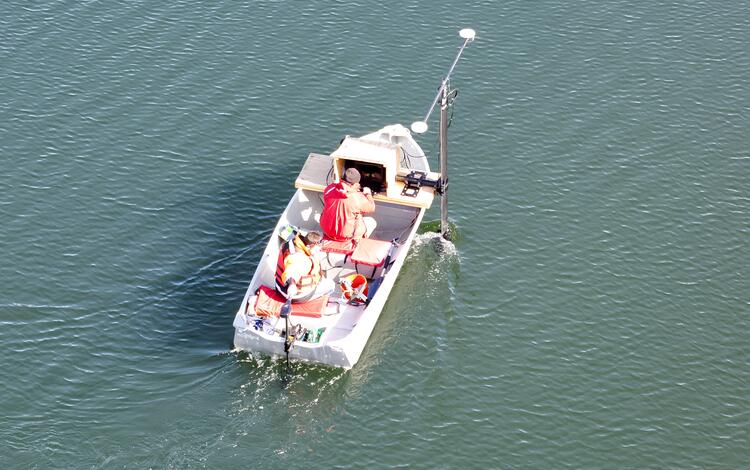 aerial view of small boat on pond