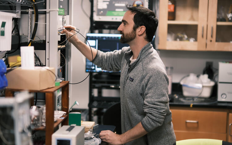 Person in lab working with equipment
