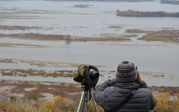 USGS biologist Mike Wellik conducting voluntary waterfowl avoidance area observations.