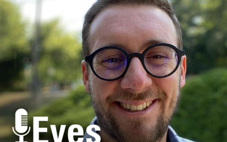 Mugshot of man wearing glasses outdoors with Eyes on Earth label in the lower left