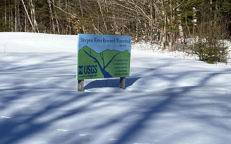 The sign of Sleepers River Research Watershed in the snow. 